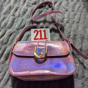 Lot 211 This item is a pink holographic crossbody handbag